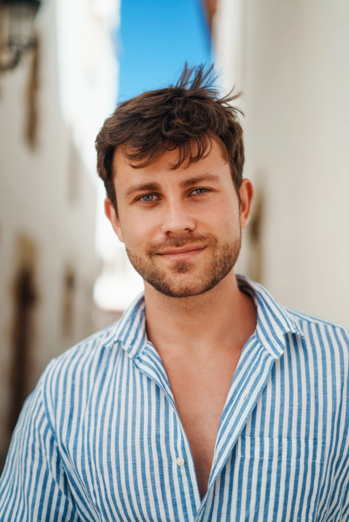 Man looking at camera on sunny day